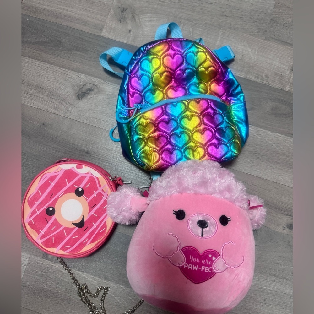 Little girl, valentine bundle gift with squish, mellow, backpack, and donut bag